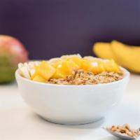 Tropical Bowl · Organic Acai blended with coconut milk and banana topped with sliced banana, fresh mango, gl...