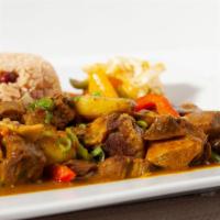 Curry Goat · Simmered in a special blend of Jamaican curry, healing turmeric, garlic & ginger