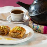 Baklava · Dessert originating in the Middle East made of phyllo pastry filled
with chopped nuts and so...