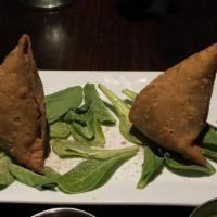 Samosa · Our famous samosas are fashioned by hand, stuffed full with mildly spiced potatoes or spiced...