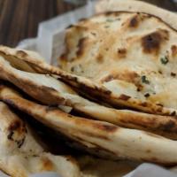 Naan Makhani · Garlic butter or garlic naan with your favorite spicy makhani sauce. An all time favorite! V...