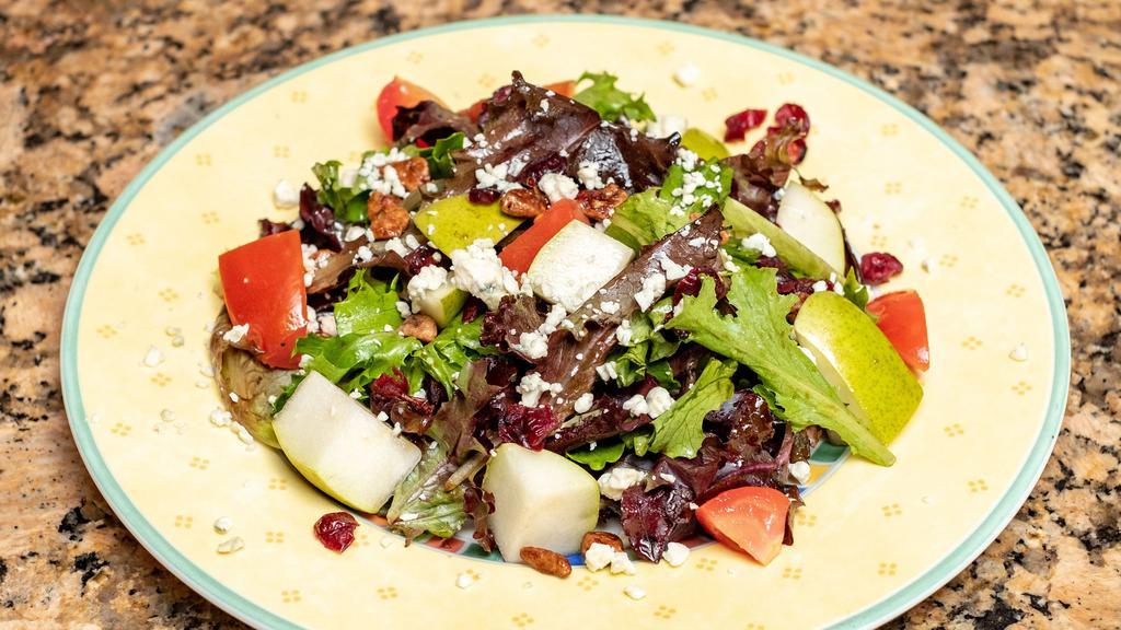 Insalata Al’ Gusto · Organic greens, roasted pecans, gorgonzola cheese, candied cranberries, slices of pears and tomatoes, and balsamic vinaigrette.