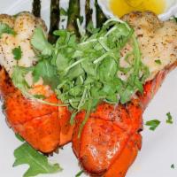 Lobster Risotto · Italian Rice sauteed with lobster tail, wild mushrooms and baby asparagus in spicy pink sauc...