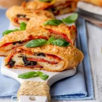 The Pepperoni Calzone · Classic pepperoni calzone filled with slices of pepperoni and ricotta cheese. Served with ma...