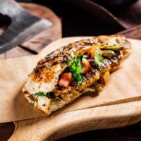 The Grilled Chicken Calzone · Sizzling grilled chicken slices inside ricotta cheese baked calzone. Served with marinara sa...