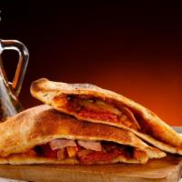 The Sausage Calzone · Chef's famous sausage slices filled inside ricotta cheese baked calzone. Served with marinar...