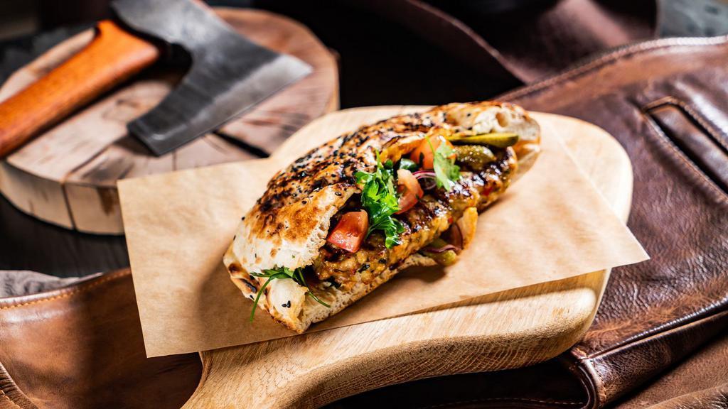 Grilled Chicken & Peppers Calzone · Sizzling grilled chicken and green peppers mixed with ricotta cheese and baked. Served with marinara sauce.