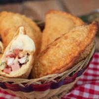 The Chicken & Sausage Calzone · Grilled chicken slices mixed with sausage and ricotta cheese wrapped in a calzone and oven-b...