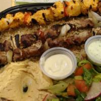 Combo Saj Plate With 4 Sides · Choose 2 protein options. All plates are served with a side of rice.