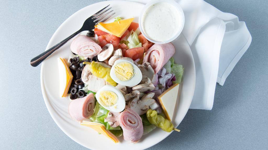 Chef Salad · Lettuce, tomatoes, onions, olives, green peppers, mushrooms, ham, turkey, American, Swiss cheese and egg.