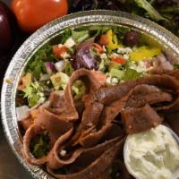 Gyros Plate · Served with Greek salad, seasoned rice, pita bread and tzatziki.