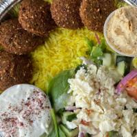 Falafel Plate · Five pieces of falafel with Greek salad and rice served with pitas.