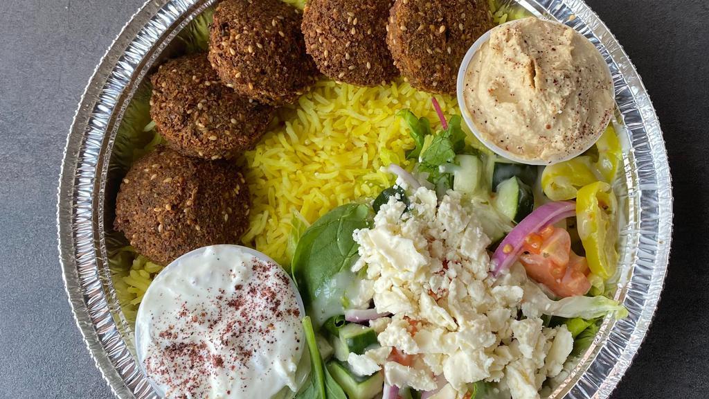 Falafel Plate · Five pieces of falafel with Greek salad and rice served with pitas.
