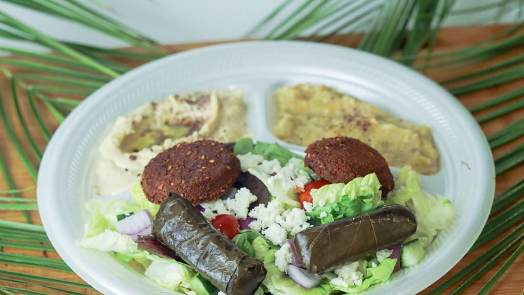 Palms Veggie Plate · Baba ghanoush hummus 2 pieces of dolma and 2 pieces of falafel served with pita bread and salad.