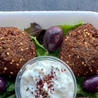 Falafel · Four pieces of crushed garbanzo beans, parsley and other spices then deep fried.