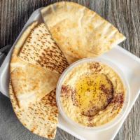 Hummus · Chickpeas, tahini, lemon, a touch of garlic and a drizzle of olive oil served with pita bread.