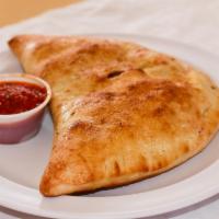 Deluxe Calzone · Mozzarella, ricotta, Pepperoni, sausage, green peppers, onions, mushrooms, black olives