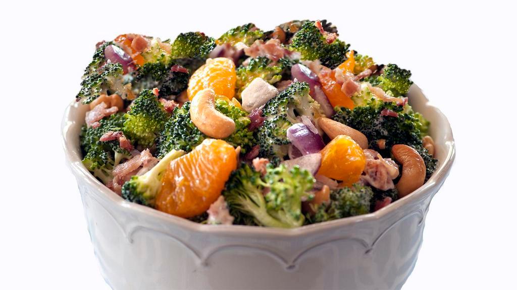 Broccoli Salad · Broccoli, golden raisins, roasted sunflower seeds, red cabbage, carrots, red onion, and bacon tossed with a lemon dressing.