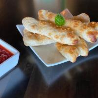 Breadsticks · baked fresh with parmigiano-reggiano & served with pomodoro sauce