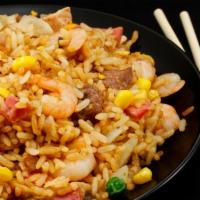 House Fried Rice · Mouth-watering chicken pieces and beef slices served with chopped seasonal veggies including...