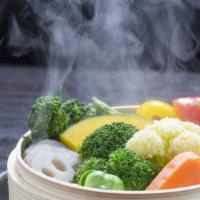 Side Of Steamed Vegetables · Seasonal vegetables, including broccoli and carrots, steamed until tender.
