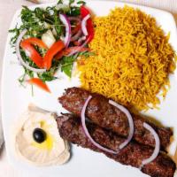 Iraqi  Kabab · two skewer of a mixed (lamb&beef) with rice &salad plate.