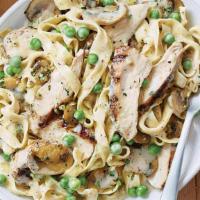 Fettuccine Carrabba · Fettuccine Alfredo with wood-grilled chicken, sauteed mushrooms and peas