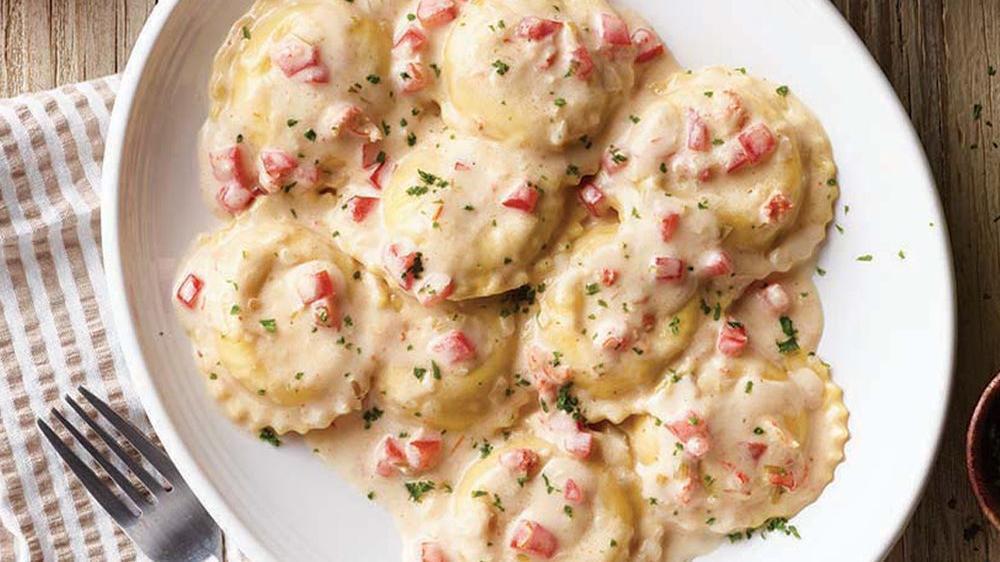Lobster Ravioli · Ravioli stuffed with lobster and romano in our white wine cream sauce topped with diced tomatoes.