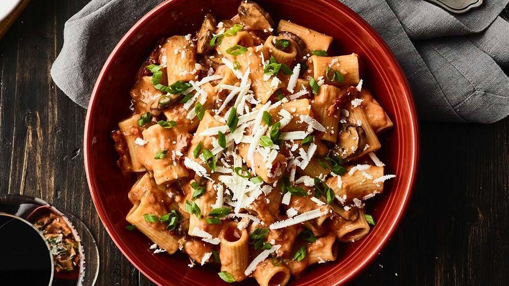 New! Penne Martino · Sauteed mushrooms, sun-dried tomatoes, parmesan and romano cheese tossed with penne pasta in our tomato cream sauce topped with scallions and ricotta salata