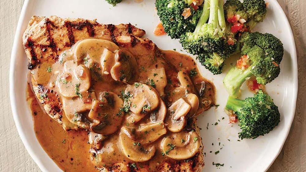 Chicken Marsala · Wood-grilled and topped with mushrooms and our Lombardo Marsala wine sauce. Served with your choice of side.