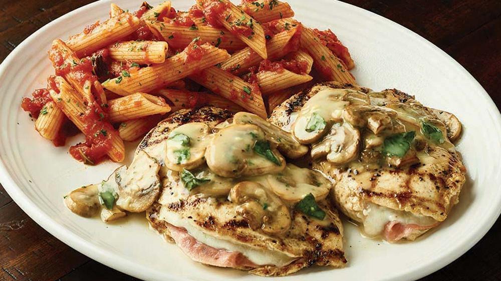 Pollo Rosa Maria · Wood-grilled chicken stuffed with fontina cheese and prosciutto, then topped with mushrooms and our basil lemon butter sauce.