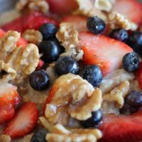 Organic Breakfast Quinoa · Cooked with Coconut Milk / Cinnamon / Fresh Strawberries / Fresh Blueberries / Walnuts / Col...