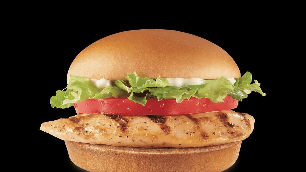 Grilled Chicken Sandwich Combo · A grilled seasoned chicken fillet topped with crisp chopped lettuce, thick-cut tomato, and mayo served on a warm toasted bun.