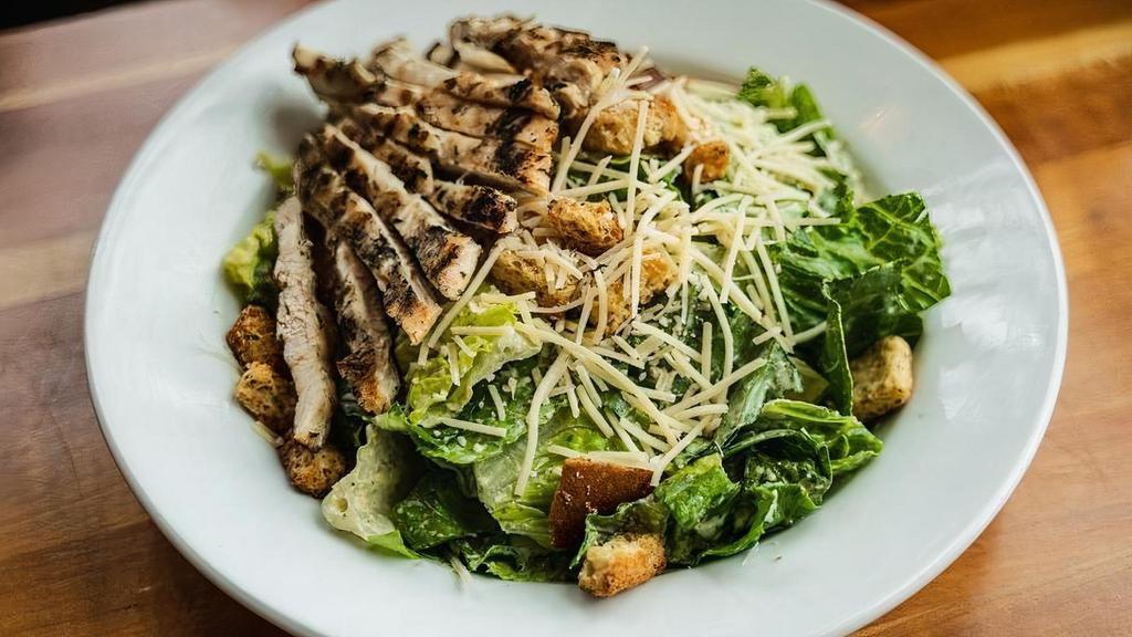 Caesar Salad* · Romaine, grilled chicken, Italian homestyle croutons, parmesan, and house-made Caesar dressing. (Contains raw eggs)