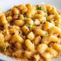 Mac N Cheese · Cavatappi pasta in creamy HUB Pilsner cheese sauce and toasted bread crumbs