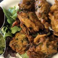Vegetable Pakora  · A refreshing blend of mixed vegetables dipped in chickpea and rice batter, and is deep fried.