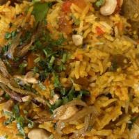 Lamb Biryani · Basmati rice cooked with lamb, onion, garlic, ginger, cashew nuts, golden raisins, spices an...