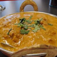Lamb Coconut Korma · Lamb cooked with coconut milk, onion and tomato gravy, garlic, ginger, cashew nuts, golden r...