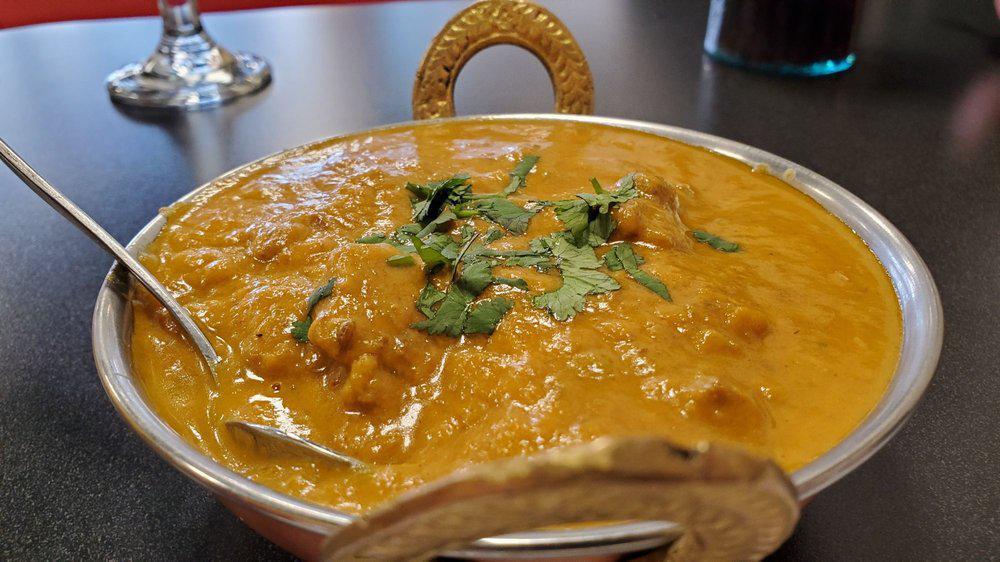 Lamb Coconut Korma · Lamb cooked with coconut milk, onion and tomato gravy, garlic, ginger, cashew nuts, golden raisins and spices lamb makhani.