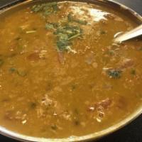 Daal Makhani · Black lentil cooked with onions, tomato, ginger, garlic and spices.