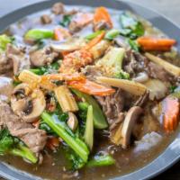 Goldie Locks (Lad Naa) / ราดหน้า · Not a soup, not wok-fried, but just right. This flat rice noodle dish combines vegetable sti...