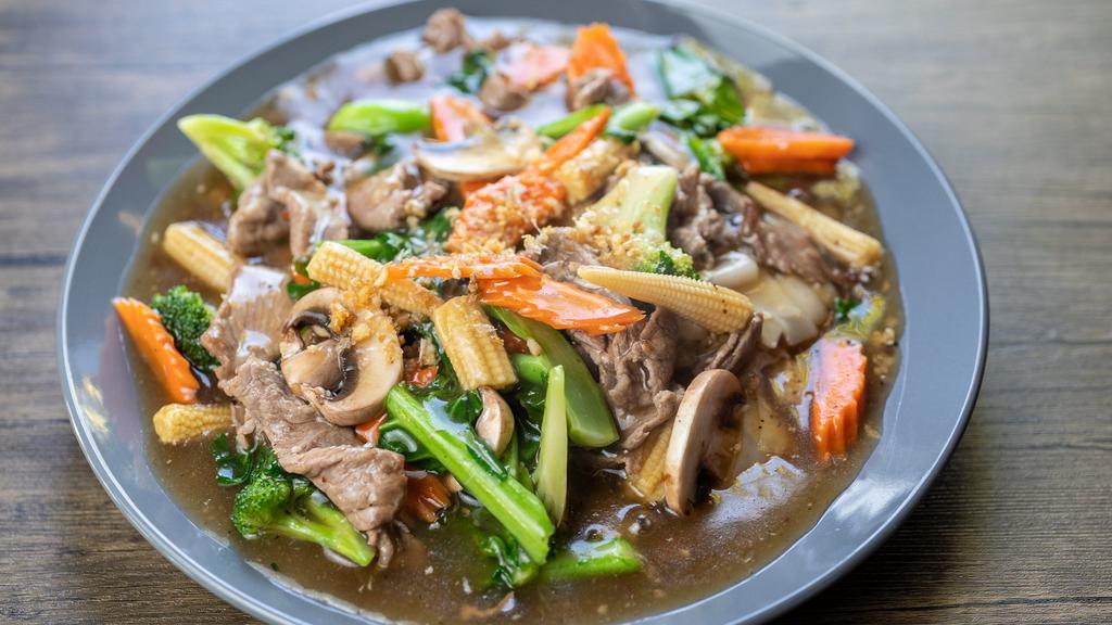 Goldie Locks (Lad Naa) / ราดหน้า · Not a soup, not wok-fried, but just right. This flat rice noodle dish combines vegetable stir fry with noodles in a thick flavorful sauce.