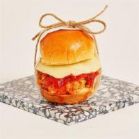 Chicken Parm Slider · Crispy fried chicken with melted mozzarella and marinara sauce on a toasted bun.