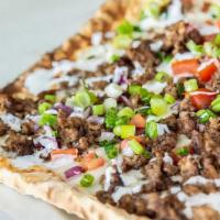 Kafta Pizza · ground beef mixed with minced onions, jalapeno, parsley, mediterranean seasoning and pomegra...