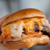 Surf N Turf Burger · Chilled Lobster, Shrimp, Spiced Aioli, Packed into a split-top butter roll.