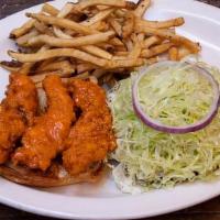 Buffalo Chicken Sandwich · Fresh tenders tossed in medium buffalo sauce on a toasted egg bun with bleu cheese dressing,...