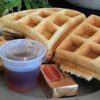 Fresh Waffle · A fresh waffle with butter and sprinkled with powdered sugar and served with syrup!