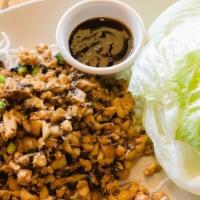 Chicken Lettuce Wrap · Minced chicken with water chestnuts, mushrooms, green onions over crispy rice sticks and ice...