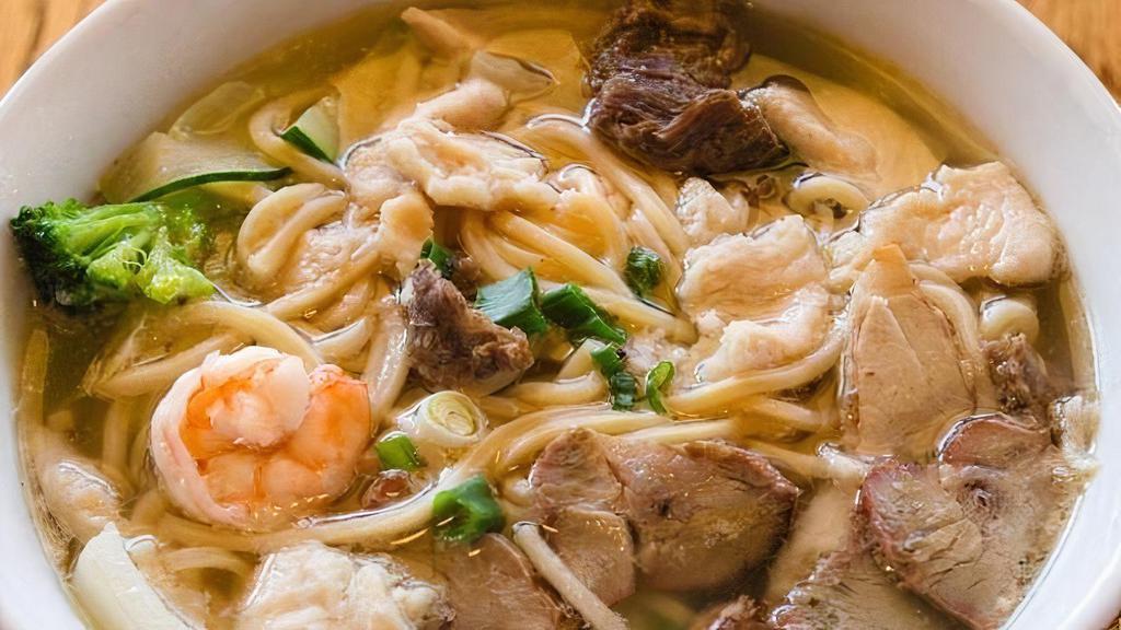 House Noodle Soup · Soft noodles with a combination of shrimp, chicken, beef, pork as well as cabbage and carrots in chicken broth.