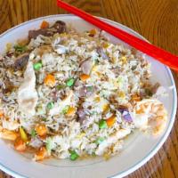 House Fried Rice (Shrimp, Chicken, Beef And Bbq Pork) · Most popular entrée. Authentic fried rice cooked with egg, peas and carrots and green onions...